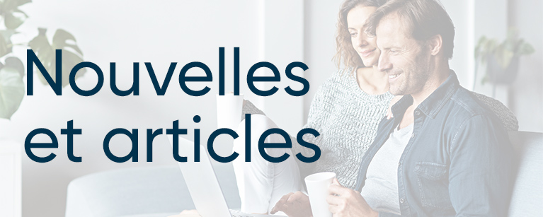 Shot of a mature couple sitting on their sofa using a laptop